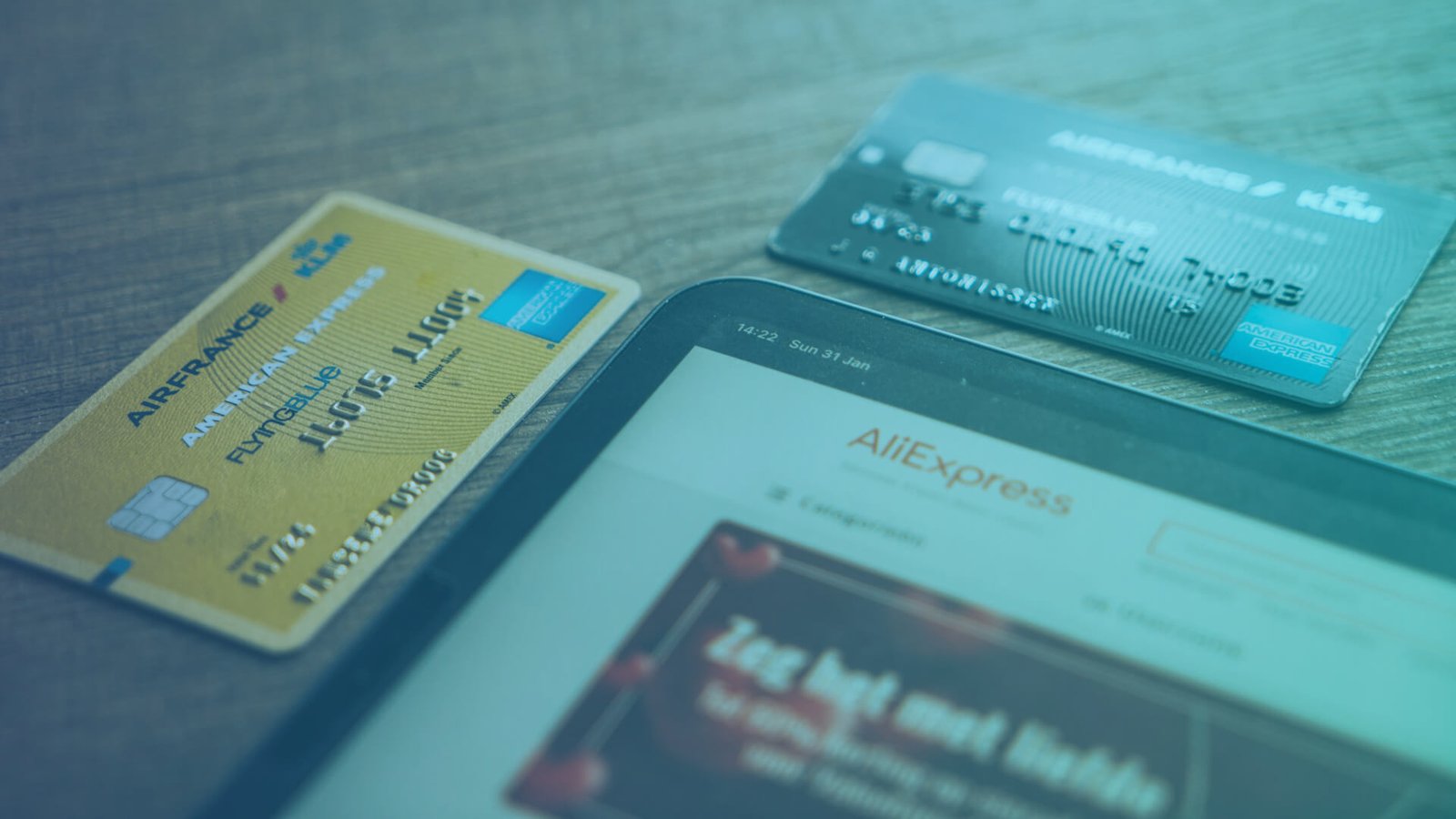 AML compliance credit cards and a device on a table