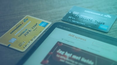 AML compliance credit cards and a device on a table