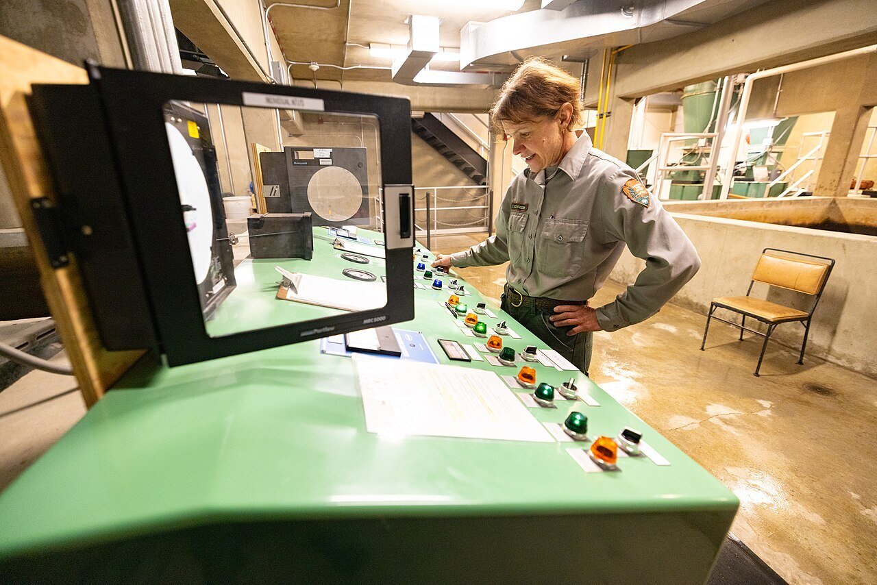 Canyon_Village_water_and_wastewater_infrastructure-_Carin_Schneider,_utility_systems_operator,_at_water_treatment_control_panel_(53086822694)