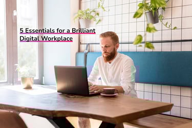 Man sitting at a desk in front of a laptop