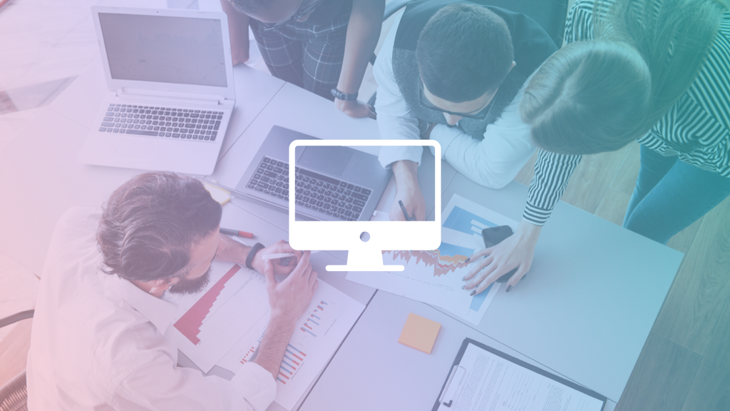 bird's eye view of workers collaborating at a desk