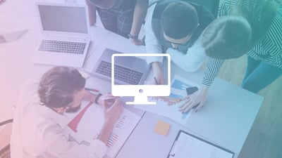 bird's eye view of workers collaborating at a desk