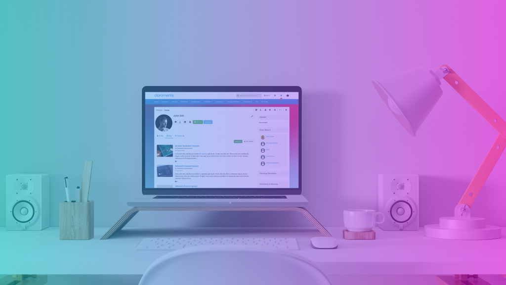 A desktop monitor displaying the Claromentis intranet software