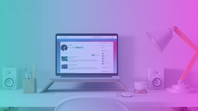 A desktop monitor displaying the Claromentis intranet software