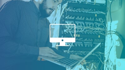 A man typing on a laptop, overlayed with a gradient filter