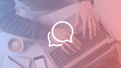 Bird's eye view of hands typing on a keyboard