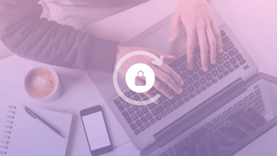Bird's eye photograph of hands typing on a keyboard, overlayed with a gradient filter