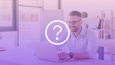 Man smiling and typing on a laptop, overlayed with a gradient filter