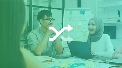 Employees sat around a work desk