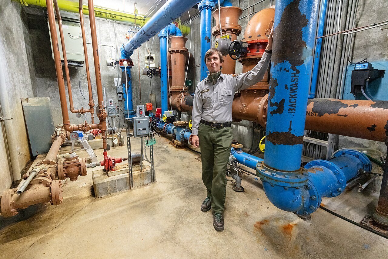 Utility_systems_operator,_Rafal_Kos,_gives_a_tour_of_the_water_treatment_facility_(50135271072)